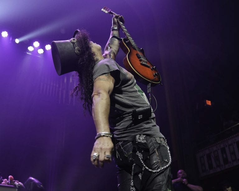Slash plays guitar at the Tabernacle